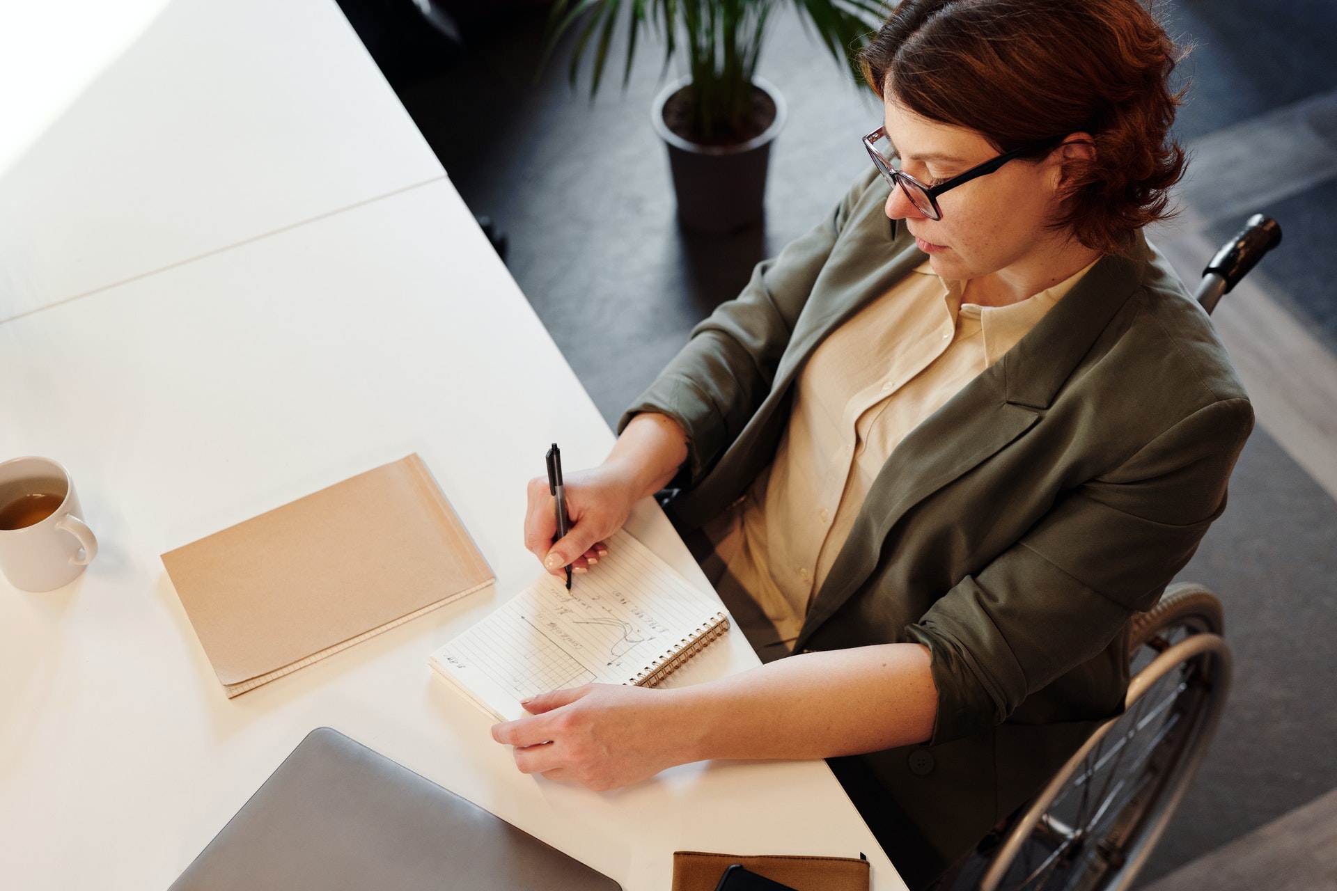 high-angle-photo-of-woman-writing-on-notebook-4064232 high-angle-photo-of-woman-writing-on-notebook-4064232